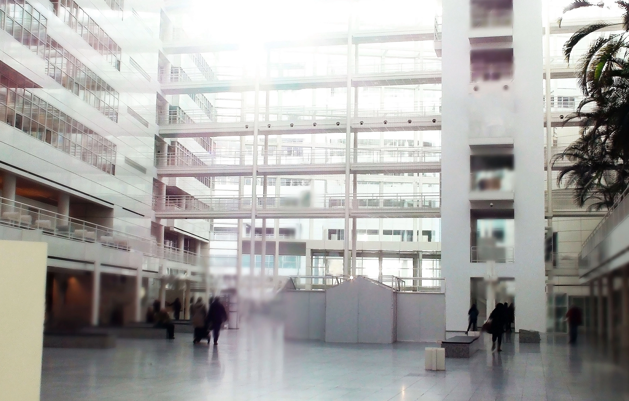 Lobby of a large building with lots of windows